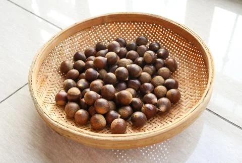 Chestnuts in a basket. Stock Photos