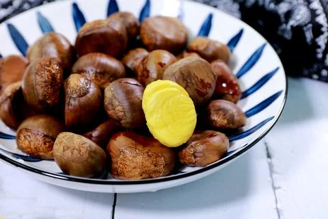Chestnuts on a plate Stock Photos