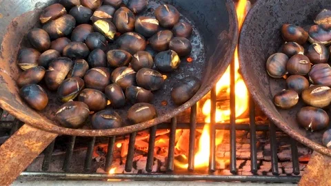 Chestnuts roasted on open fire Stock Footage 95969257