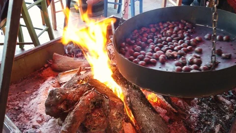 Chestnuts roasting on fire close up Stock Footage 121665784