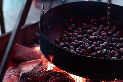 Chestnuts roasting on fire close up Stock Photos