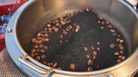 Chestnuts Roasting in Rotating Drum at Asian Street Market Stock Footage 329369270