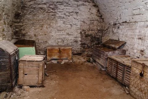 Chests and boxes in the basement of an old house Stock Photos
