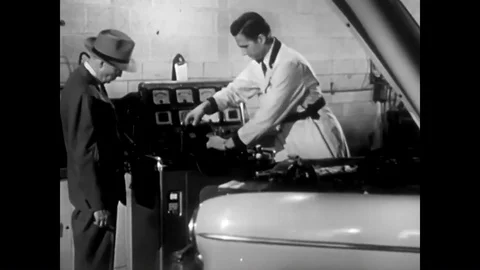 A Chevrolet serviceman uses a machine to check the components of a customers car Stock Footage 88553003