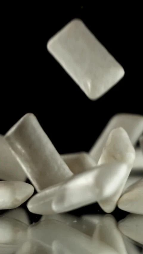 Chewing gum falls on the table. Filmed on a high-speed camera at 1000 fps Stock Footage 335374479