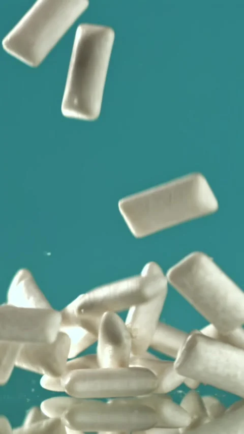Chewing gum falls on the table. Filmed on a high-speed camera at 1000 fps Stock Footage 335378152