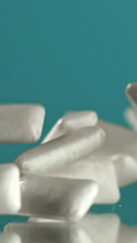Chewing gum falls on the table. Filmed on a high-speed camera at 1000 fps Stock Footage 335378223