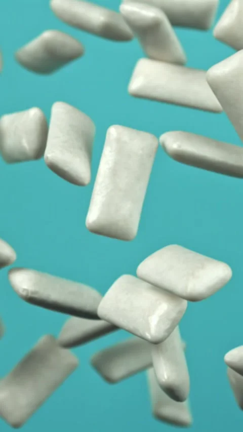 Chewing gum flies on a blue background. Filmed on a high-speed camera at 1000 Stock Footage 335381520