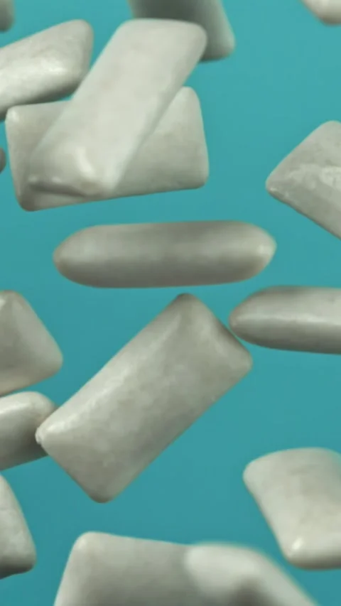 Chewing gum flies on a blue background. Filmed on a high-speed camera at 1000 Stock Footage 335383897