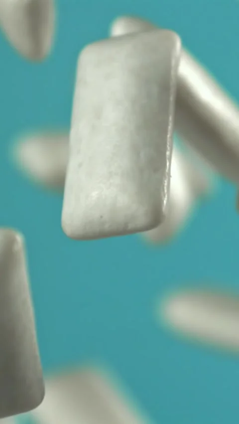 Chewing gum flies on a blue background. Filmed on a high-speed camera at 1000 Stock Footage 335384061