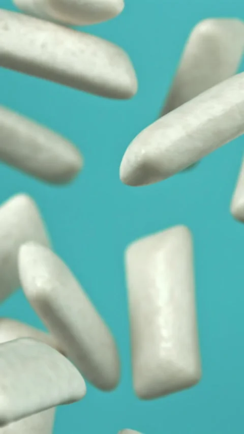 Chewing gum flies on a blue background. Filmed on a high-speed camera at 1000 Stock Footage 335384605
