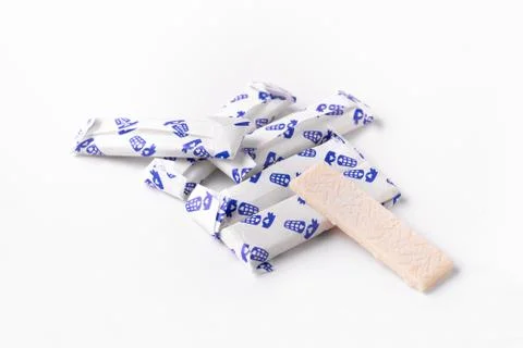 Chewing gum in a foil wrapper on a white background. Group of chewing gums Stock Photos