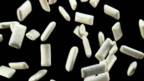 Chewing gum rises up and rotates in flight. Filmed is slow motion 1000 fps. Vídeos de archivo 202140734