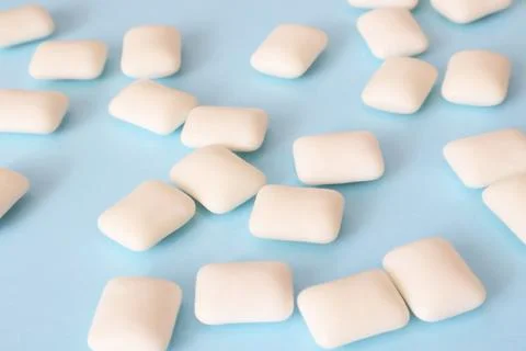 Chewing gums on a blue background Stock Photos