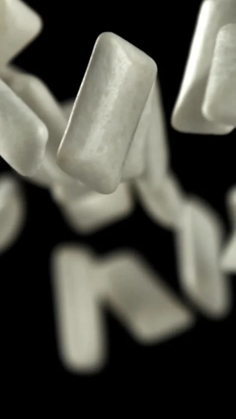 Chewing gums fly on a black background. Filmed on a high-speed camera at 1000 Stock Footage 335384130