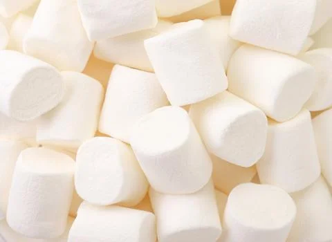 Chewing marshmallow white, background. The view from top Stock Photos