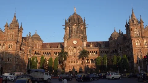 Chhatrapati Shivaji Terminus railway station and traffic late afternoon, Mumbai Stock Footage