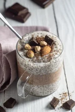 Chia pudding with cocoa, chocolate and nuts in almond milk Stock Photos