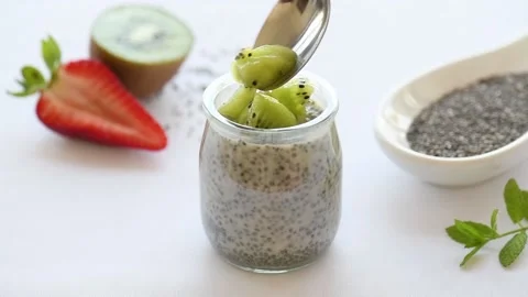 Chia Pudding Decorated With Kiwi and strawberry slices Stock Footage 139925207