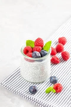 Chia pudding with fresh berries and almond milk. Superfood concept. Vegan, ve Stock Photos