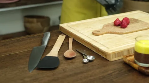 Chia pudding making process. Strawberry on wooden board Stock Footage 137944031