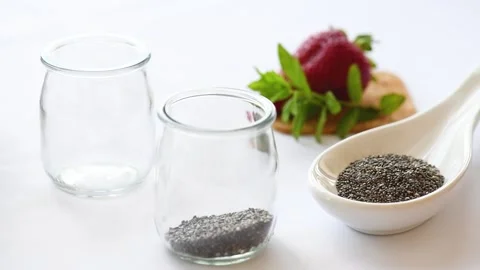 Chia Pudding: Putting Chia Seeds in a jar. detox and healthy superfood breakfast Stock Footage 139925073