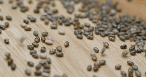 Chia seed falling and rotating macro studio Видео 101468272