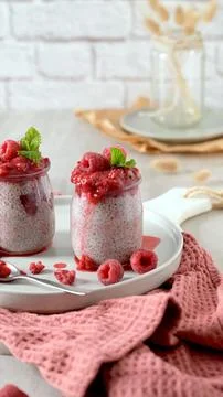 Chia Seed Pudding Cups Topped with Fresh Raspberry Compote Stock Photos