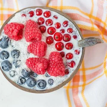 Chia seed pudding with different berries in a bowl Stock Photos