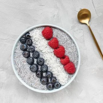 Chia seed pudding with different berries in a bowl Stock Photos