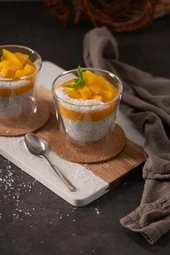 Chia Seed Pudding with Fresh Mango and Shredded Coconut in Glass Cups Stock Photos
