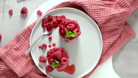 Chia seed pudding with fresh raspberry coulis, top view Stock Footage 315973952