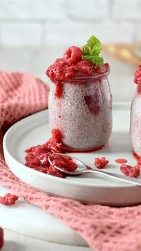 Chia seed pudding with fresh raspberry coulis Stock Photos