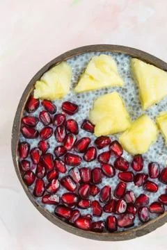 Chia seed pudding with mango and pomegranate in a bowl Stock Photos