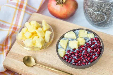 Chia seed pudding with mango and pomegranate in a bowl Stock Photos
