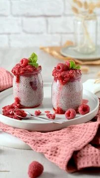 Chia Seed Pudding with Raspberry Puree in Glass Jars Stock Photos