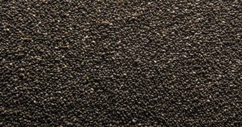 Chia seeds close up studio shot over rotating Video stock 334255697