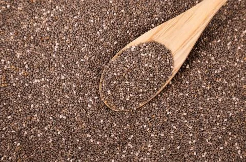 Chia seeds with wooden spoon Stock Photos