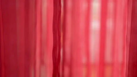 Chic and elegant texture of the moving folds of light red fabric. Backdrop of Stock Footage 131170864