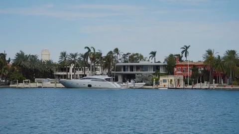 Chic boat on the bakground of blue waters and beautiful mansions on sunny isles Stock Footage 101134964