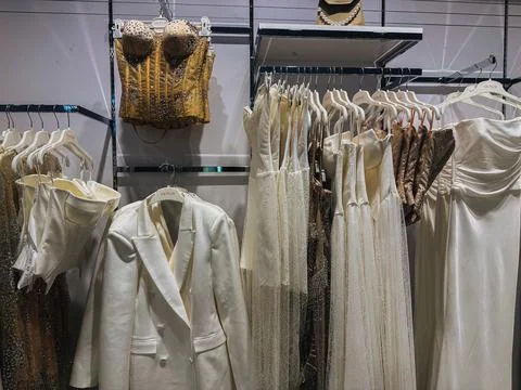 A chic boutique displaying a range of elegant dresses and stylish accessories. A Stock Photos