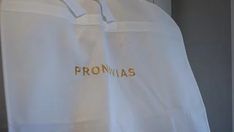 Chic Couture Storage Solution With Detailed Satin Gown Display And Refined Video stock 323897365