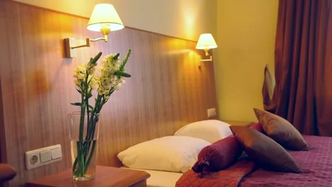 A Chic Hotel Bedroom Decorated in Red Tones. Stock Footage 306400869