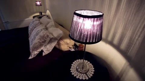 Chic Hotel Bedroom with Mischievous, Violet Shade Night Lamp Stock Footage 263345086