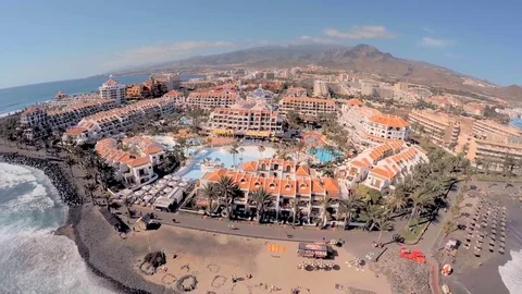 Chic hotels on the beach in the background of mountains. Stock Footage 77551134