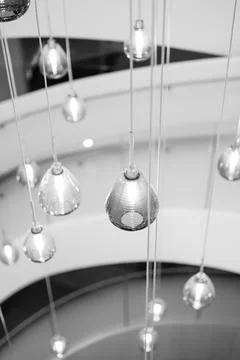Chic luminous installation featuring floating glass ornaments within Stock Photos