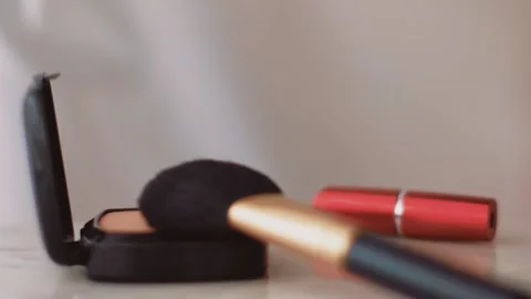 Chic make-up products on marble table, powder, lipstick and brush as background Stock Footage 135067663