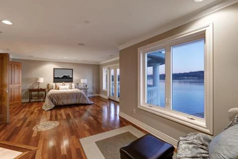 Chic master bedroom with pale grey walls paint color,  Stock Photos