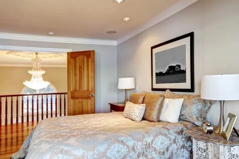 Chic master bedroom with pale grey walls paint color, Stock Photos