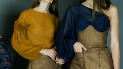 Chic models with beautiful legs in high-heeled shoes professionally posing Stock Footage 93542575